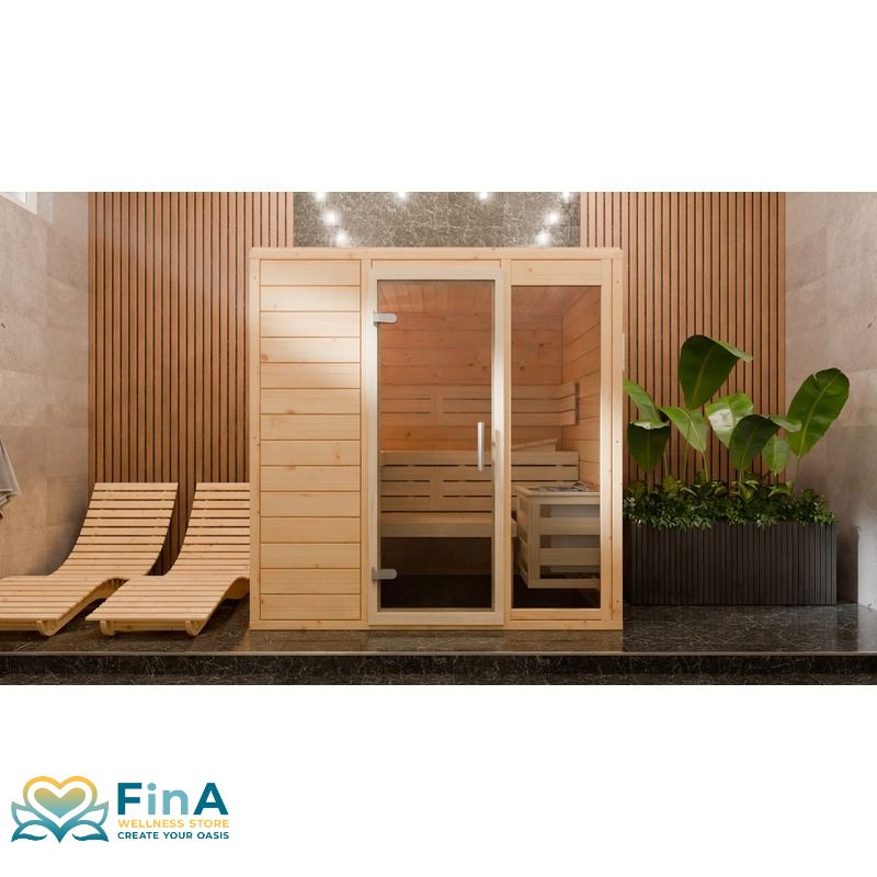 Frieda Innensauna von FinA Wellness mit eleganter Glasfront, hellen Fichtenholzwänden und Liegebänken in stilvollem Wellnessbereich mit Pflanzen