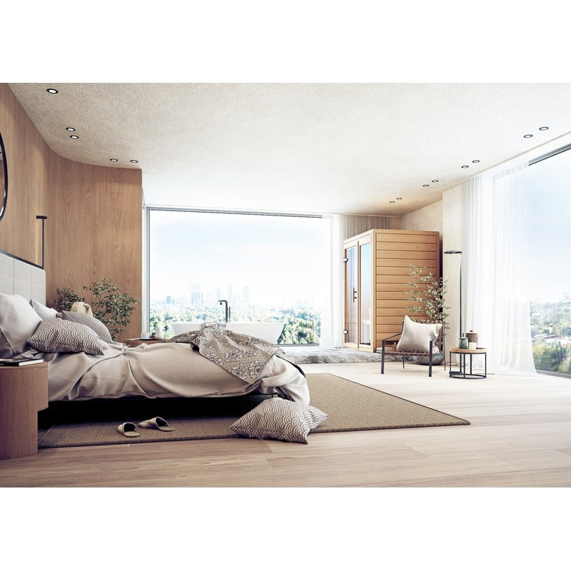 FinA Wellness Frieda Mini Sauna – stilvoll integriert in ein modernes Schlafzimmer mit freistehender Badewanne und Panoramafenster