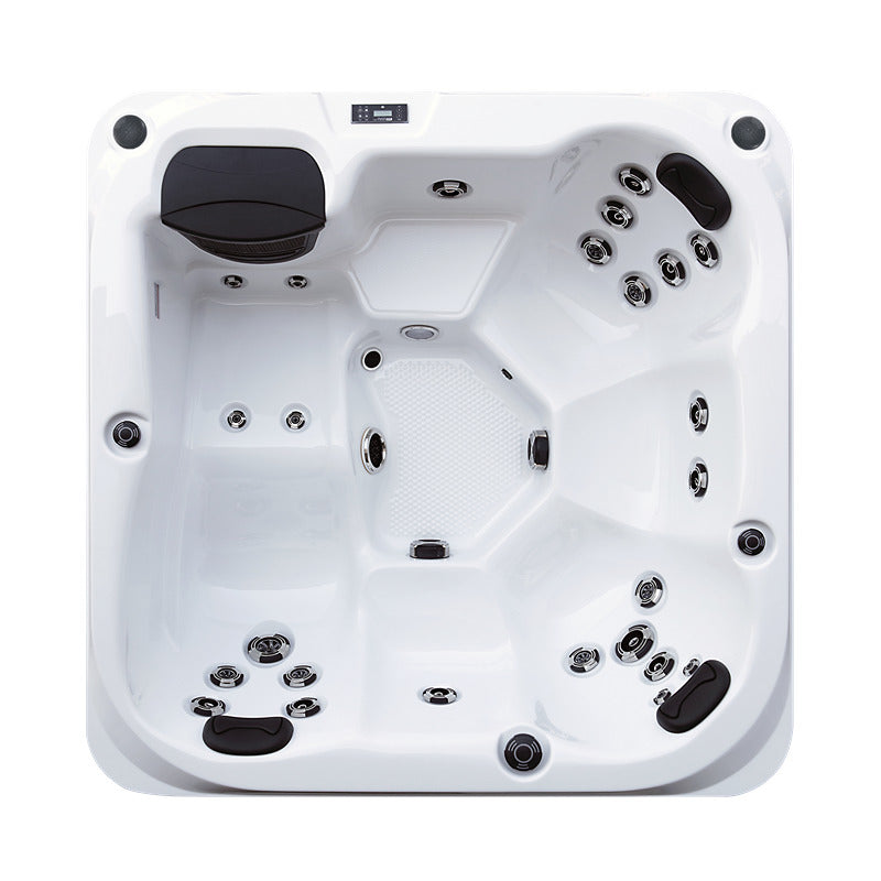 Top-Down-Perspektive des Platinum Spas Reims Outdoor-Whirlpools – strukturiertes Bodendesign, ergonomische Formgebung und LED-Panel.