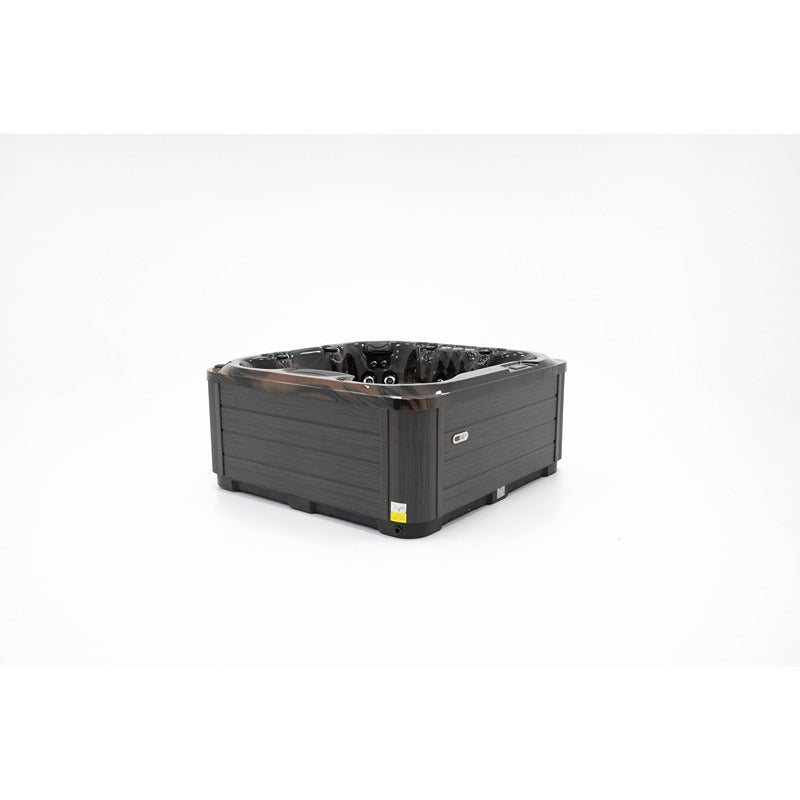 „Platinum Spas Seville Whirlpool in schwarzer Ausführung, Eckansicht mit dunkler Verkleidung und elegantem Acrylbecken – für 7 Personen, modern und hochwertig