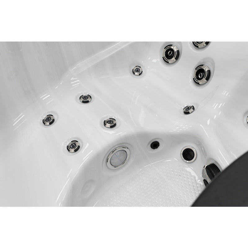 Platinum Spas Tahiti Hot Tub – Innenraumdetail mit Bodenstruktur, Fußmassagedüsen und Wasserzirkulationselementen für ganzheitliches Spa-Erlebnis