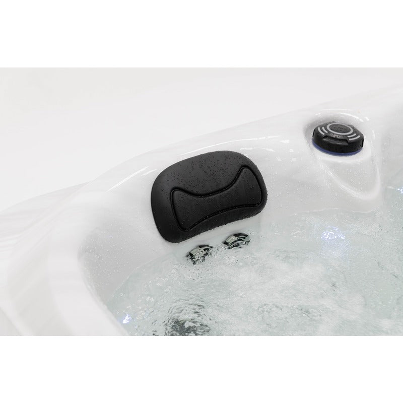 Platinum Spas Tahiti Hot Tub – Nahaufnahme einer gepolsterten Kopfstütze und manueller Steuerung bei laufender Wasserzirkulation für maximalen Komfort im Spa