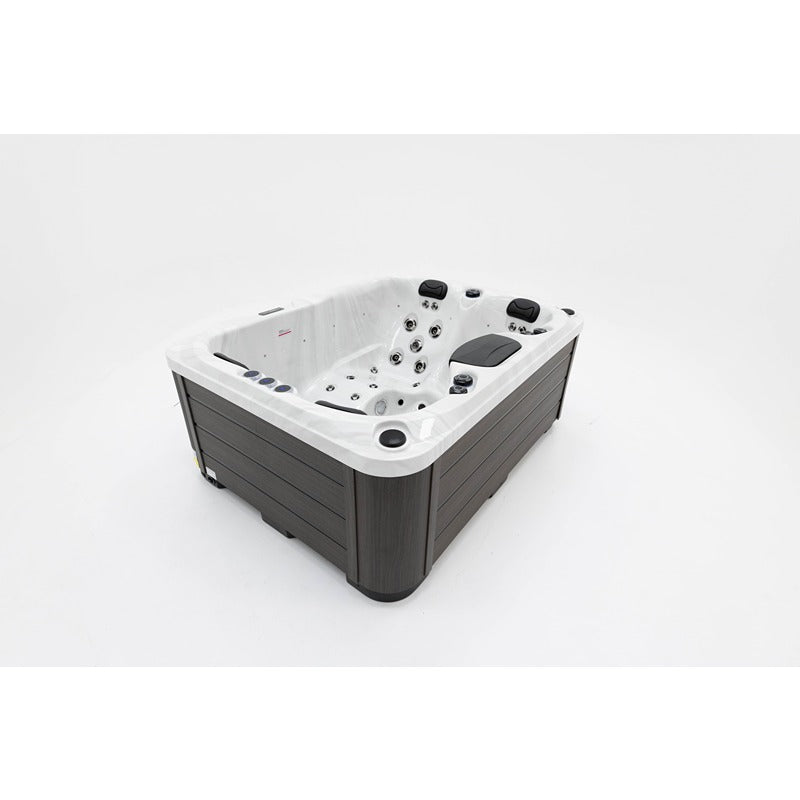 Platinum Spas Tahiti Hot Tub – schräge Draufsicht mit sichtbarer Liegefläche, Massagezonen und stilvoller Verkleidung für ein exklusives Spa-Erlebnis im Garten