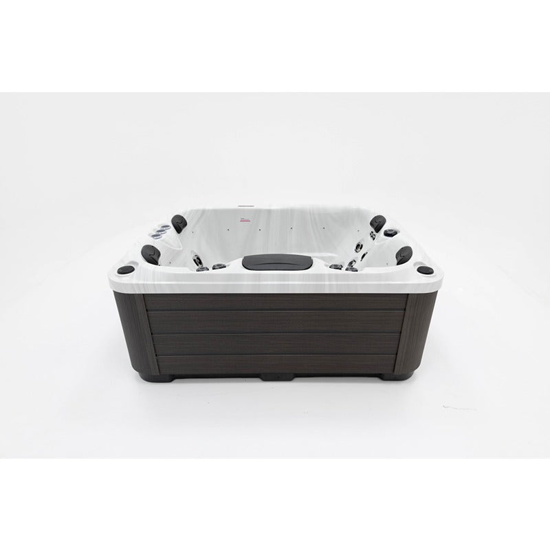 Platinum Spas Tahiti Hot Tub – Rückseitige Topansicht mit ergonomisch angeordneten Massagesitzen und dunkler Holzverkleidung für modernes Outdoor-Wellnessdesign