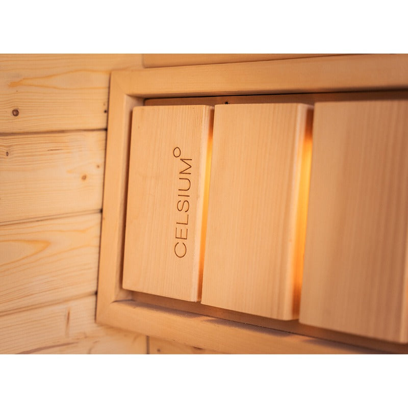 Detailansicht der Celsium Ula Small Sauna mit integriertem Holzpaneel und sanfter Hintergrundbeleuchtung – hochwertiges Innenfinish mit Celsium Branding