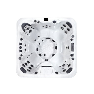 Innenansicht des Colombo Whirlpools mit sieben ergonomisch geformten Sitzplätzen und 48 Massagedüsen – großzügiges Spa-Erlebnis für Gruppen.