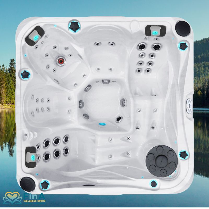 Vogelperspektive auf den Passion Spas Desire Whirlpool für 6 Personen – modernes Spa-Design mit zahlreichen Edelstahl-Massagedüsen, LED-Elementen und zwei großzügigen Liegeflächen vor naturinspiriertem Hintergrund.