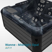 Wanne - Midnight Opal Whirlpool mit schwarzem Wannenrand, mehreren Massagedüsen und grauen Kopfstützen von oben fotografiert