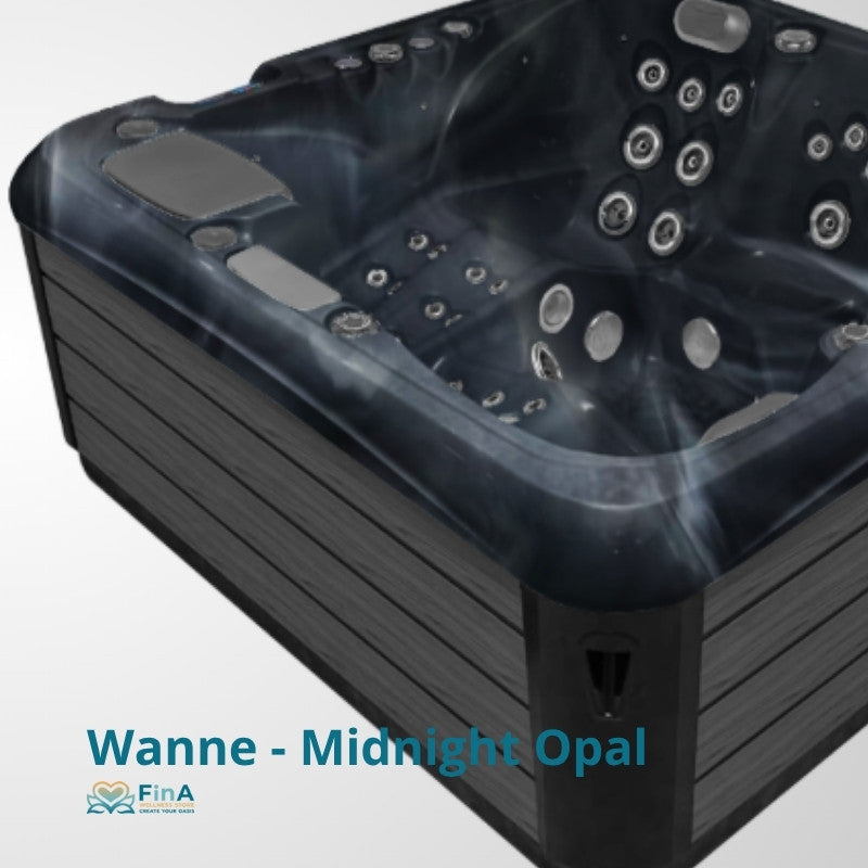 Wanne - Midnight Opal Whirlpool mit schwarzem Wannenrand, mehreren Massagedüsen und grauen Kopfstützen von oben fotografiert