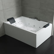 Rechteckige Whirlpool-Badewanne EAGO AWT GE120TSL in Weiß mit integrierten Massagedüsen, schwarzen Armlehnen und grauem Kopfkissen in modernem Badezimmer