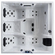 Draufsicht auf den EAGO AWT IN-402 extreme pro Outdoor Whirlpool mit quadratischem weißem Becken, zahlreichen Massagedüsen und schwarzen Bedienblöcken an den Seiten