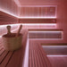  Stilvolle Sauna-Bank mit Holzaufgusskübel und rosa LED-Hintergrundbeleuchtung