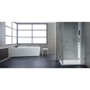 Modernes Badezimmer mit weißer Eckbadewanne EAGO GE105E und begehbarer Dusche mit Glastür auf grauem Fliesenboden