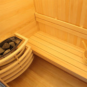Innenansicht der EAGO AWT E1804C Sauna mit Pinienholz-Verkleidung, Saunaofen mit Steinen und Holzbank