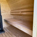  Innenansicht der Celsium Herkus Small Gartensauna mit heller Holzverkleidung und zweistufiger Saunabank.