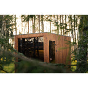 Außenansicht der Celsium Jonas Grand Gartensauna mit klarer Kubusform und Holzfassade.
