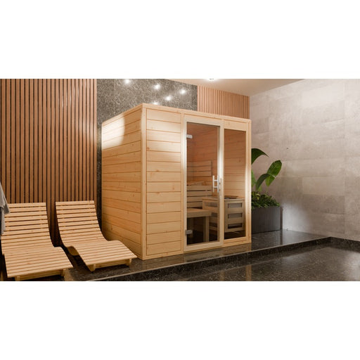 Seitenansicht der Frieda Innensauna aus massiver nordischer Fichte mit großzügiger Glastür, integriert in modernem Wellnessbereich mit Ruhezonen