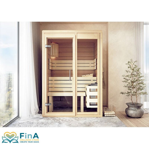 FinA Wellness Frieda Mini Sauna mit Glastüren in hellem Holz, integriert in modernem Wohnzimmer neben großem Fenster und Pflanze