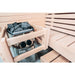 Nahaufnahme des Harvia Vega Compact Saunaofens mit Saunasteinen und umlaufendem Holzschutz in einer kompakten Sauna.