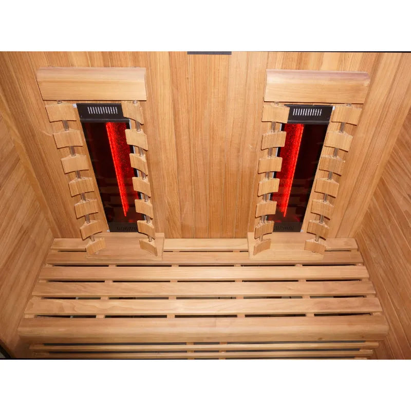 Innenansicht der Hekla IR 160 Infrarotsauna mit zwei glühenden roten Infrarotstrahlern an der Holzdecke und Holzbank