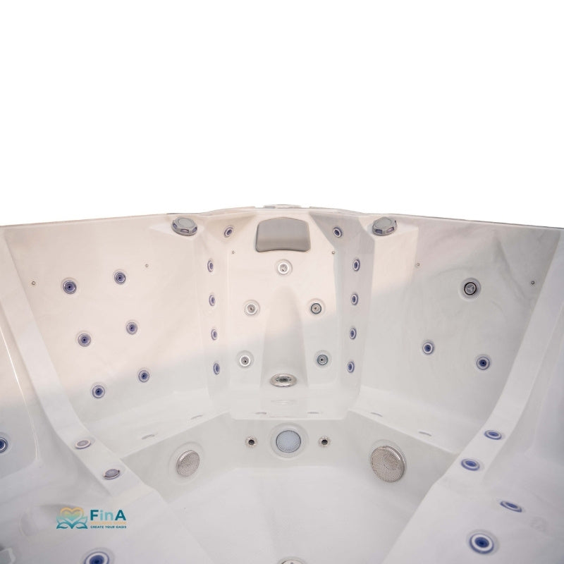 Blick von oben auf einen weißen Whirlpool JJSPA Alpha 923 mit zahlreichen Düsen und integrierter Kopfstütze