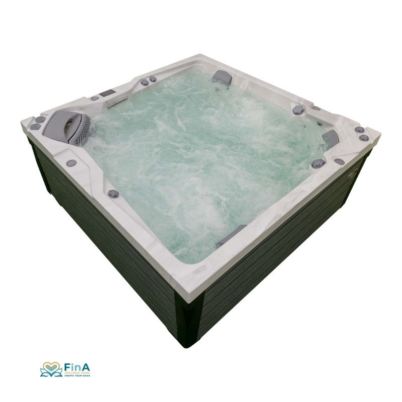 JJSpa Alpha 923 Premium Whirlpool mit weißem Rand und grüner Holzumrandung, sprudelnd gefüllt mit türkisem Wasser, Draufsicht
