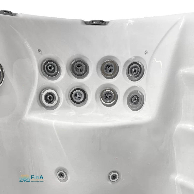 Draufsicht auf weißes JJSpa Beta 6151 Swim Spa mit acht runden Massagedüsen im Beckeninneren und zwei weiteren Düsen am Boden