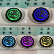 Fünf LED-Bedienungstasten der JJSpa Alpha 723 in verschiedenen Farben: grün, blau, hellblau, magenta und gelb mit Spa-Symbol, in weiße Kunststoffblenden eingelassen.
