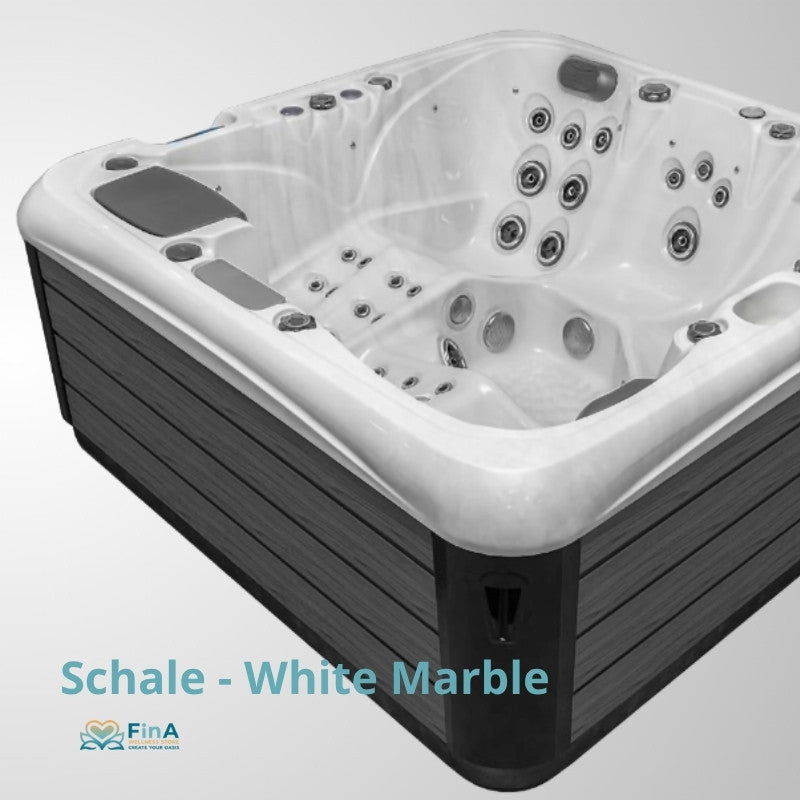 JJSPA Alpha 723 Whirlpool in Weiß-Marmor mit schwarzem Unterrahmen, ausgestattet mit mehreren Massagedüsen und Bedienfeldern, von oben fotografiert