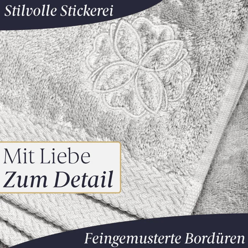 Liebenstein Saunahandtuch in Hellgrau mit feingmusterter Bordüre und eleganter Stickerei-Verzierung im Detail