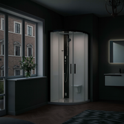 Novellini Glax 1R Dampfdusche in Schwarz Matt – elegante Runddusche mit Glasfront im modernen Badezimmer mit Tageslicht.