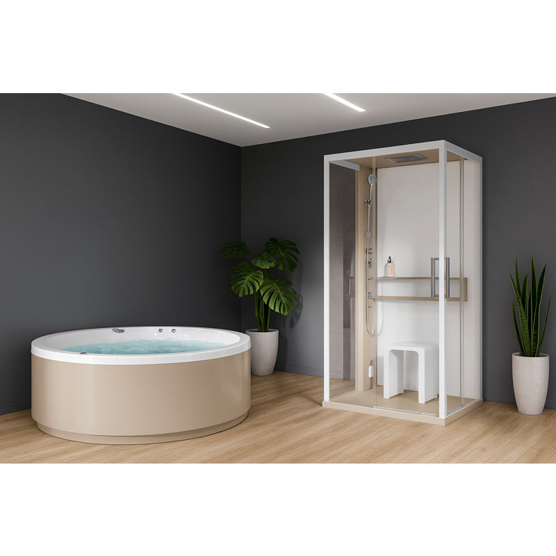 Moderne Dampfdusche Novellini Glax 2 A+F mit Glasfront neben rundem Whirlpool in elegantem Wellnessraum mit Holzfußboden und Pflanzen.
