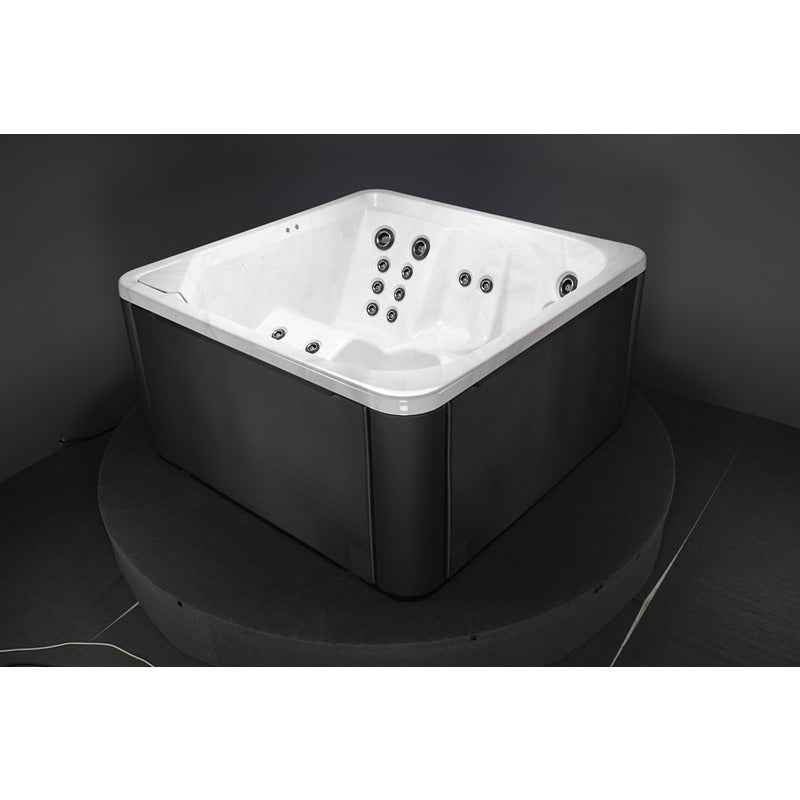 Novitek S-1 Outdoor Whirlpool mit weißem Innenbereich und schwarzem Außengehäuse, mehrere Massage-Düsen sichtbar, quadratisches Design für 4 Personen