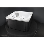 Novitek S-1 Outdoor Whirlpool mit weißer Innenschale und grauem Außengehäuse, ausgestattet mit Massagedüsen und Luftsprudler-System