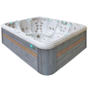 Passion Spas Repose Whirlpool 254x204 – Außenansicht mit grauer Verkleidung und Oak-Zierleisten
