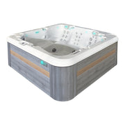 Passion Spas Retreat Whirlpool mit weißem Becken, Holzumrandung in Grau und Braun, Massagejets und Kontrollpanel, quadratisches Design für 6 Personen.