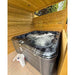 Passion Spas Rewind Whirlpool 204x204 unter Pergola im privaten Außenbereich