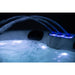 Platinum Spas Tahiti Hot Tub – stimmungsvolle Nachtaufnahme mit beleuchteten Wasserfontänen und weichem LED-Licht, ideal für entspannte Spa-Abende im Freien