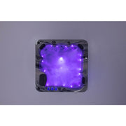 Platinum Spas Refresh Outdoor Whirlpool – Deluxe, für bis zu 6 Personen, Farbe: Odyssey. Draufsicht mit lila LED-Beleuchtung bei aktivierten Massagedüsen.