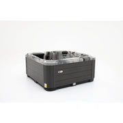 Platinum Spas Refresh Outdoor Whirlpool – Seitenansicht, Farbe: Odyssey. Zeigt elegantes Außendesign mit grauer Holzoptik-Verkleidung und abgerundeten Ecken.