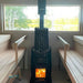 SW H700 Sauna-Ofen mit Schutzgitter und Saunasteinen – installiert in moderner Holzsauna