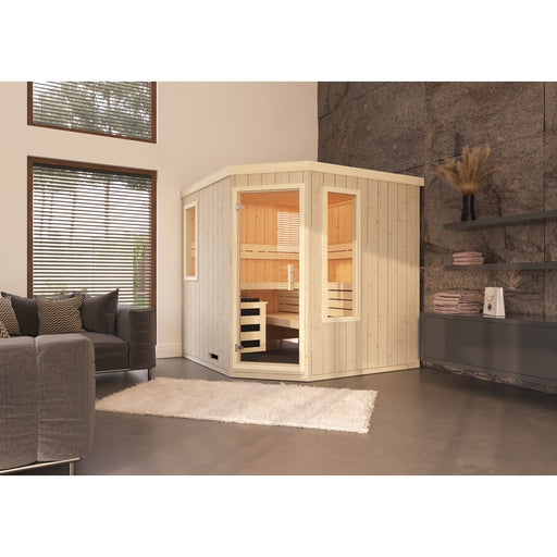 FinA Wellness Leyla Ecksauna aus naturbelassenem Massivholz – harmonisch integriert in modernes Wohnzimmer mit Natursteinwand