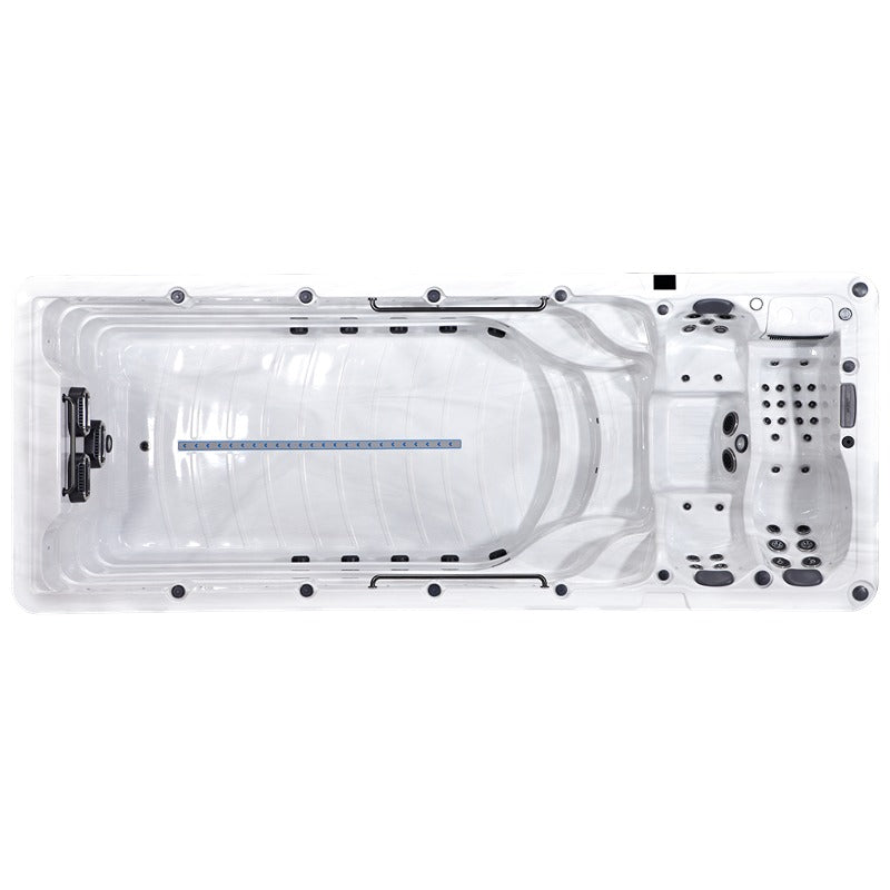 Draufsicht auf Platinum Spas Zelus Swim Spa mit geriffeltem Wellness-Becken, Massagedüsen und Kontrollpanel in Weiß