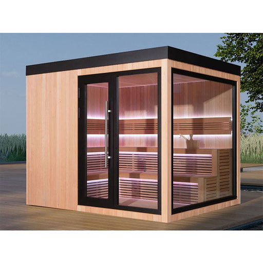 Moderne AWT The Cube X7-L Hemlock Außensauna 300×235 cm mit großer Glasfront und LED-Ambientebeleuchtung auf Holzdeck im Garten