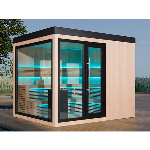 AWT The Cube X7-L Hemlock Außensauna 300×235 cm mit EOS Cubo Ofen, großer Glasfront und blauer LED-Ambientebeleuchtung auf Holzdeck im Garten
