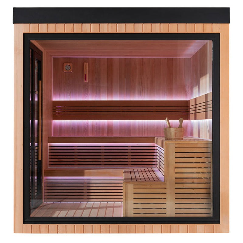  Innenansicht der AWT The Cube X7-L Hemlock Außensauna 300×235 cm mit zweistufigen Bänken, Aufgusszubehör und LED-Ambientebeleuchtung in warmem Rosaton