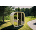  Celsium Ula Mini Sauna in Beige mit Ganzglasfront im Garten – moderne Außensauna für zwei Personen mit natürlicher Umgebung und stilvollem Design