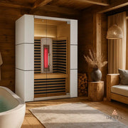 Delta SPA COLORINA full spectrum Infrarot-Sauna mit weißem Rahmen und Glastüren in modernem Wellness-Raum