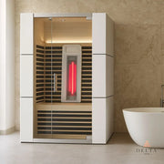 Delta SPA COLORINA full spectrum Infrarot-Sauna mit weißem Rahmen, Glastür und aktiviertem roten Infrarot-Heizelement im modernen Badezimmer