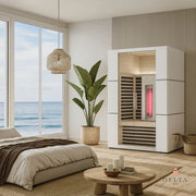 Delta SPA COLORINA full spectrum Infrarot-Sauna mit Glastür im modernen Schlafzimmer mit Meerblick